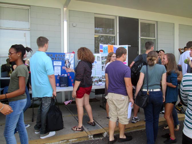 Students gather outside the cafeteria during lunch to see what clubs are available to join for the 2012-2013 school year.