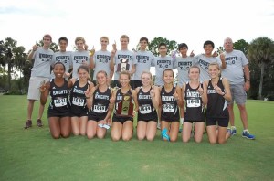 The boys and girls cross country team pose for a picture after their wins Wednesday afternoon. The teams are lead by head Coach Mark Altimari and assistant coach Melissa Mosseau. 