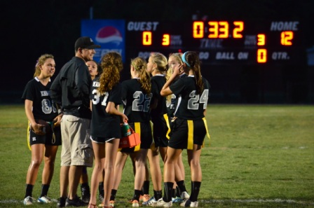 The Knights huddle up after scoring the game capping touchdown.