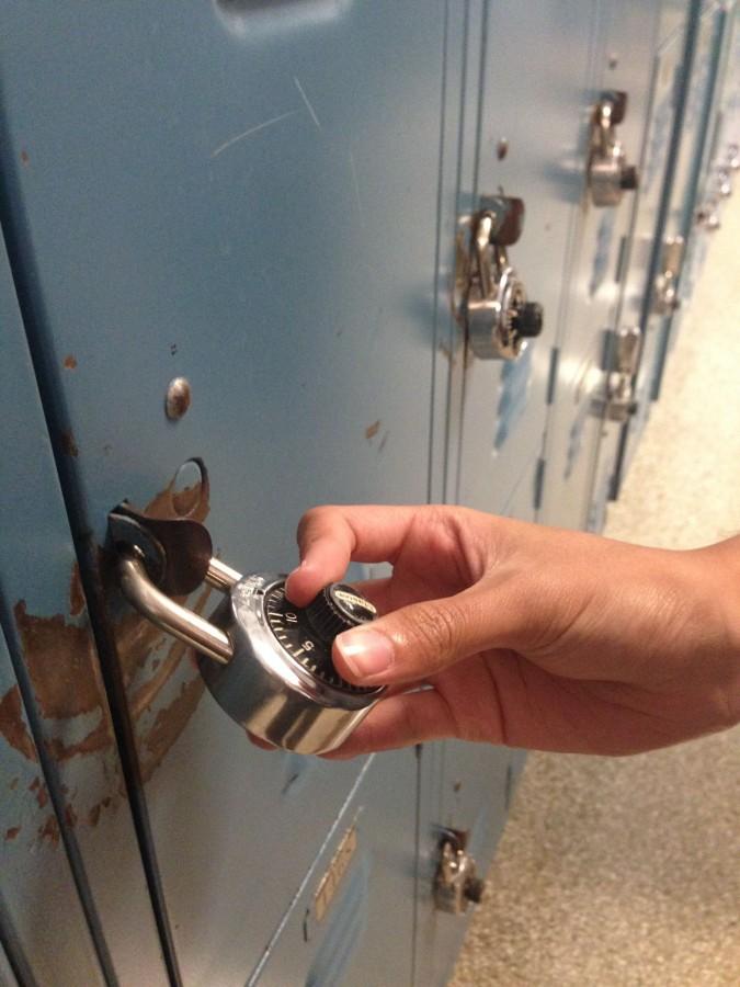 Student makes a quick stop to his locker in between class periods.