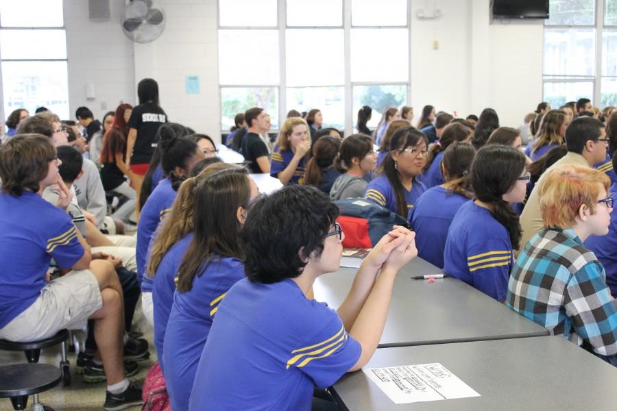 National Honor Society members attend a meeting in the cafeteria.