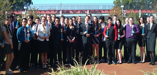 FBLA members pose with awards after attending the awards ceremony.