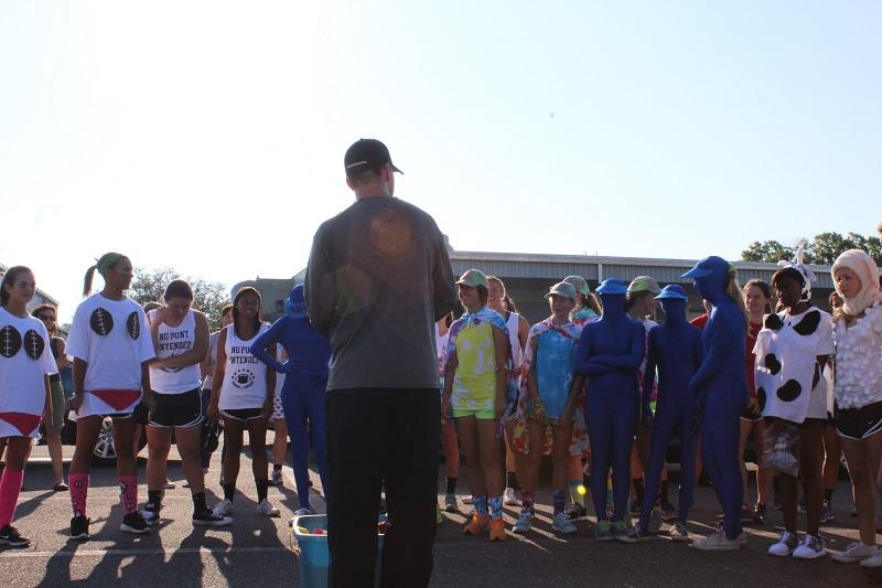 Head Coach Josh Saunders explains the rules of the race to the team.