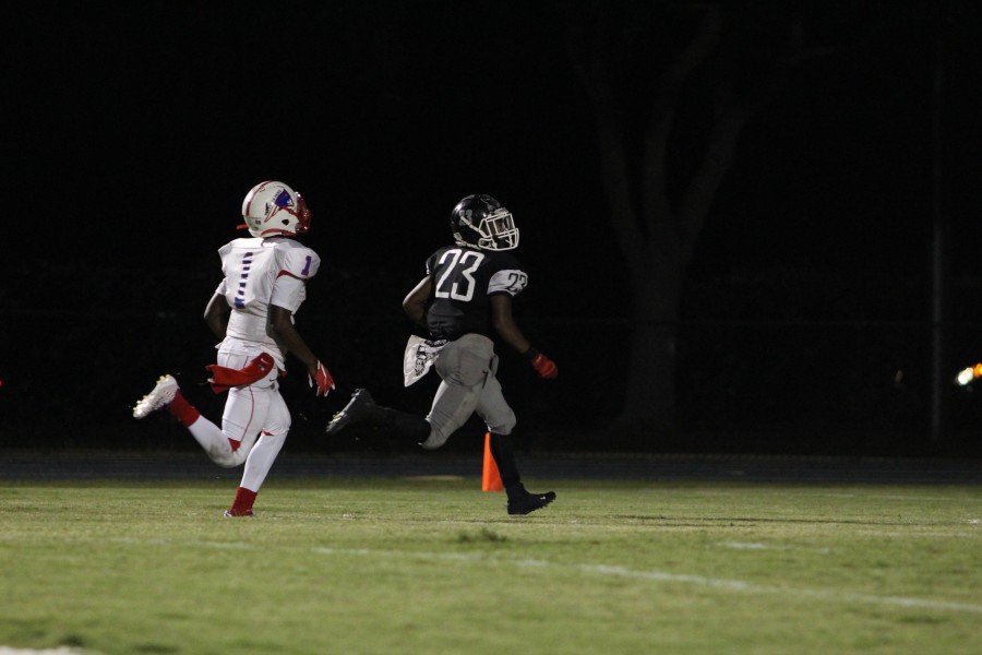 Wide receiver Iyan Mitchell (16) runs the ball into the end zone for one of his three touchdowns of the night.