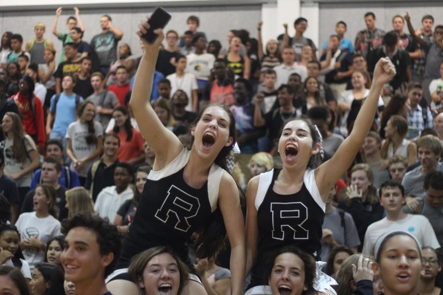Cheerleaders Katherine Weck and Lauren Cohen participate in the spirit chant during the 2015 Plant pep rally.