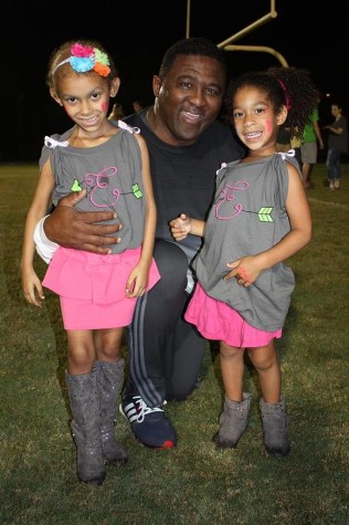 Ellie, Robinson principal Johnny Bush and younger sister Jayda pose for a photo before the lighting of the RHS letters.