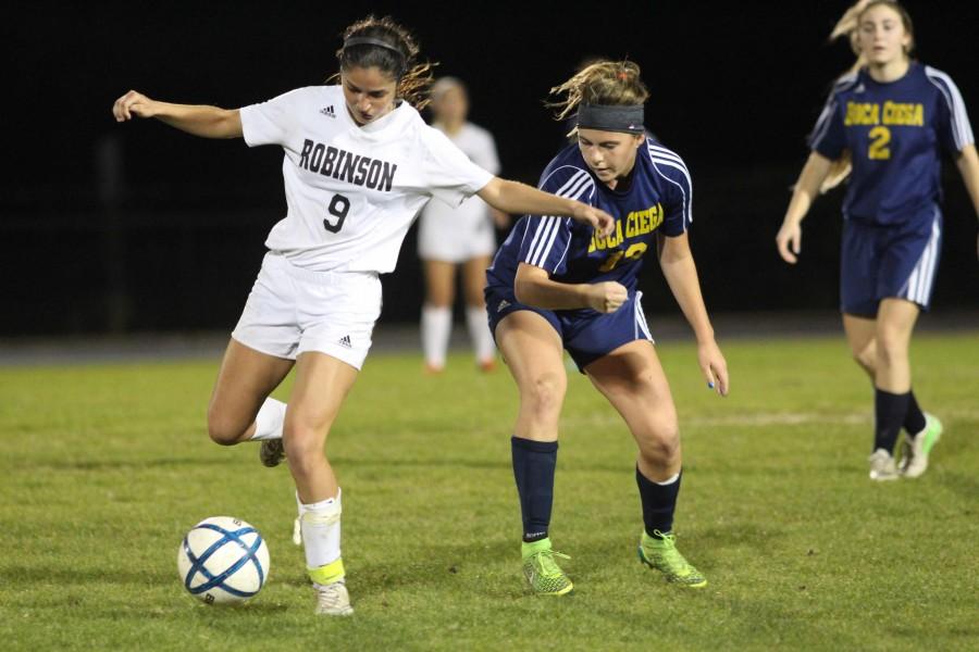 Captain Sarah Jennewein (17) fights off Boca Ciega Captain Devyn Nyhart (18). Jennewein scored one goal, in the second half of the game.