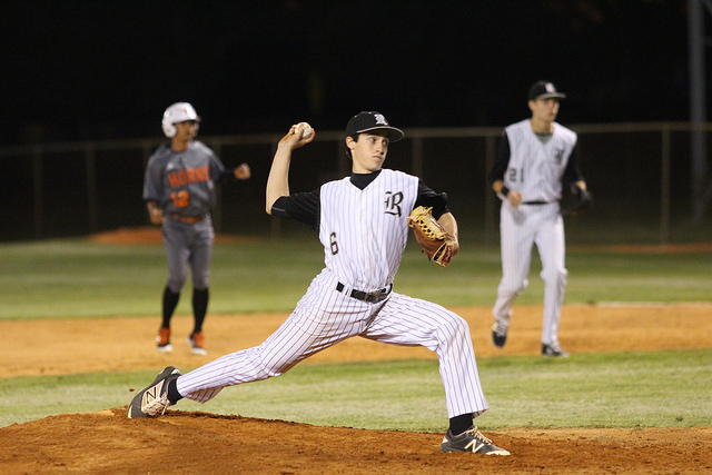 With an eye on home plate, pitcher Jake Granese (18) prepares to release the ball during the teams non-district matchup against Lennard. Granese, who pitched four and two-thirds innings, helped the team to a 6-5 victory.
