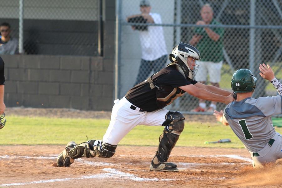 Catcher Shawn McGory (16) tags out Sickles Johnathan Oddson (16).