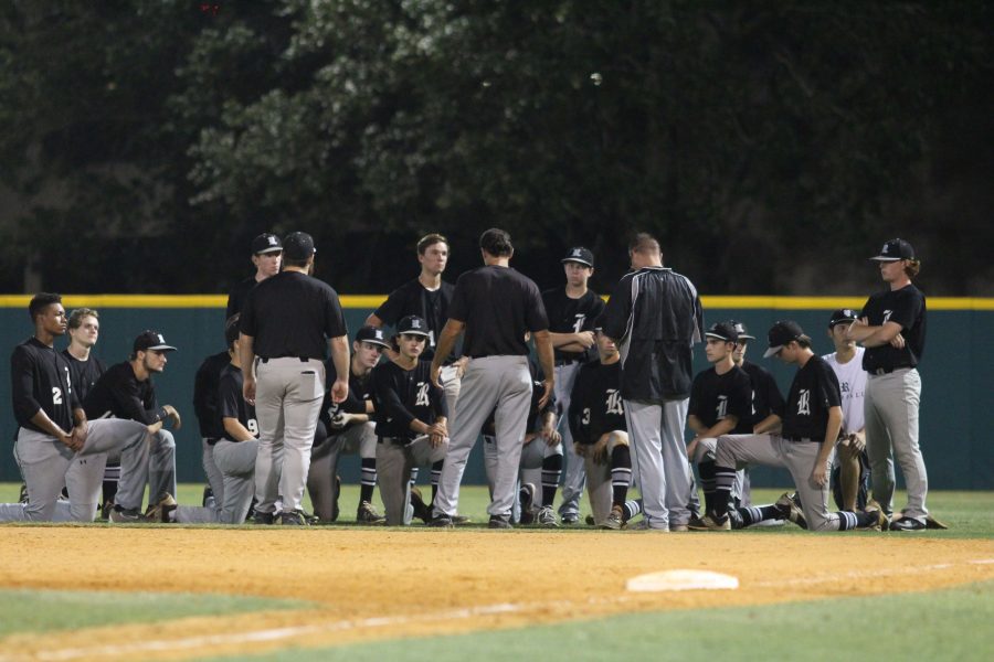 Head coach Kevin McCray talks to the team after their 5-0 loss to Jesuit in the regional semifinals.