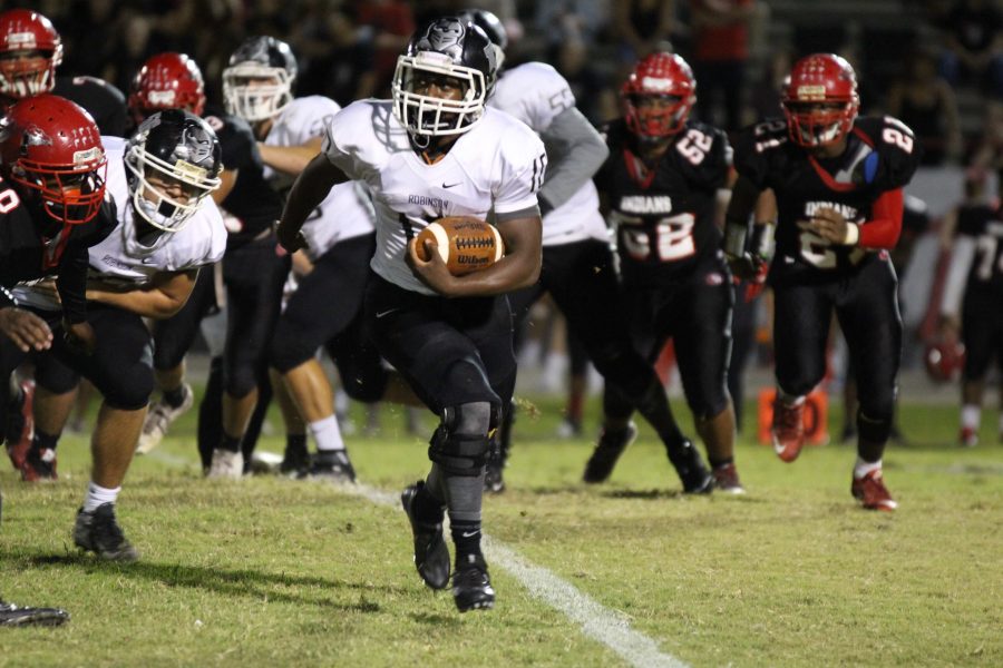 Running back Anfernee Alston (17) escapes East Bay during the third quarter.