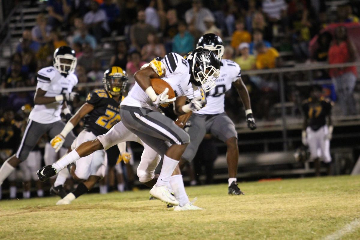 Wide receiver Cameron Lockridge (19) tries to run the ball into the end zone to beat Blake on Friday night.