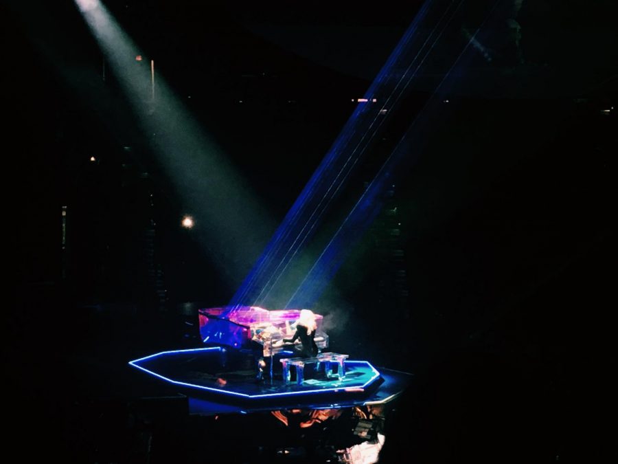 GaGa plays the piano during the concert