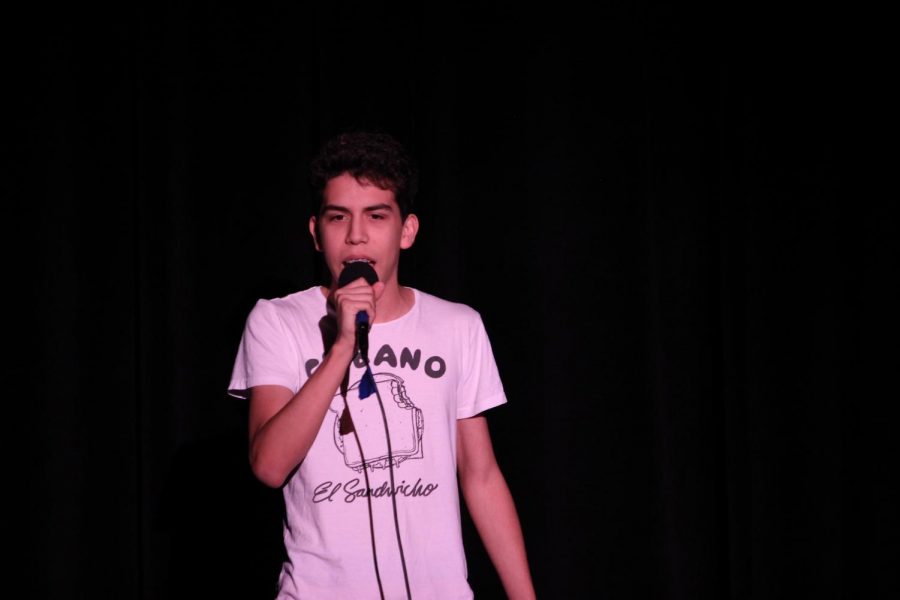 David Navas (20), band student and talent show performer, sings a song by Little Mix. 