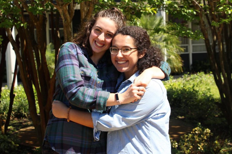 Anna Thomas (18) (left) and Lillian Martin (18) (right), the two nominees for Writer of the Year, embrace each other for a photo.