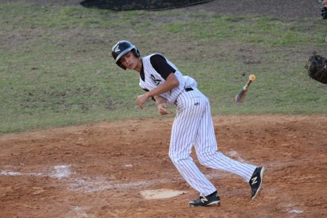 Andrew McMillan (18) heads to first base after a walk against Sickles on Thursday, April 26.