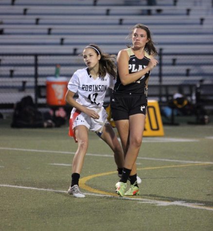 Macey Hatton (19) pulls the flag off of the Plant quarterback during a defensive play. 