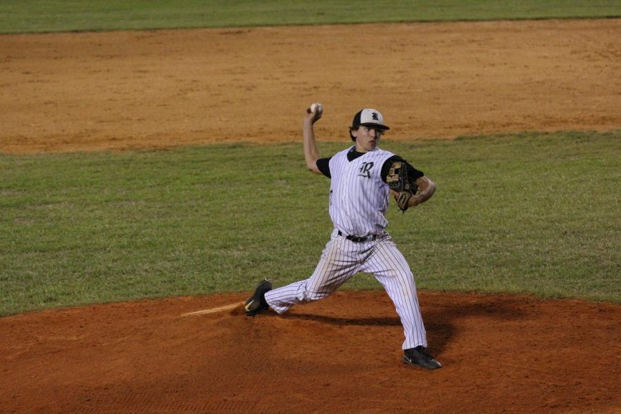 Mikey Swanson (19) winds up to pitch. 
