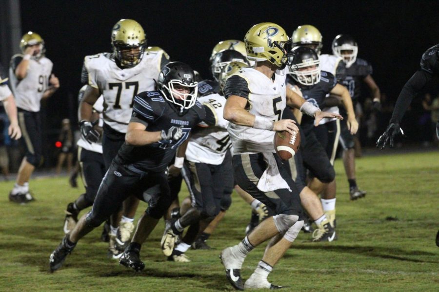 Jo Jo Muffoletto (19) helps sack Plants quarterback in the South Tampa matchup last Friday.