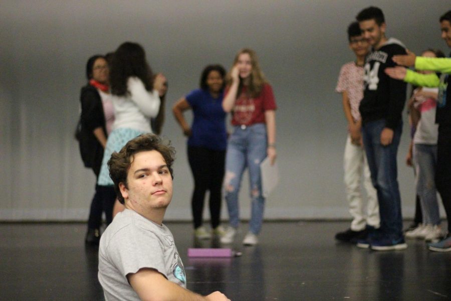 Charles Davidson works with the cast to craft a scene from his play, Dystopia: A Teen Parody.