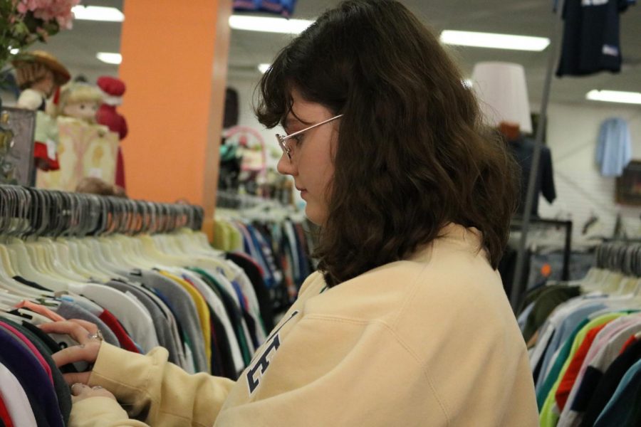 Lilly Brill (21) looks at the mens t shirts section, a popular section to most Robinson Students.