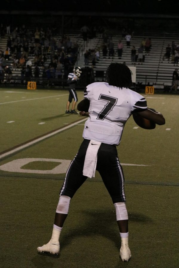 Quarterback Rickeem Parks (22) warms up before the Plant rivalry game.
