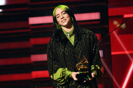 Billie Eilish accepts one of her many awards from the 62nd Grammy Awards (credit Rolling Stone).