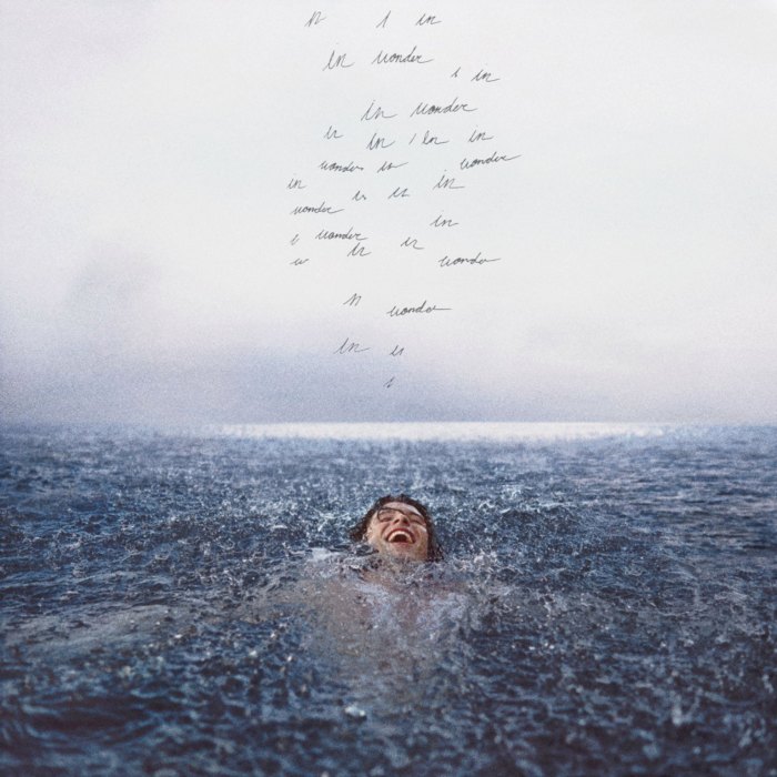 The album cover for Shawn Mendes Dec. 4 album Wonder. The cover shows Mendes floating with a smile on his face as handwritten lines display variations of the phrase In Wonder.