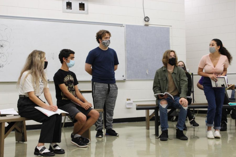 From left to right: Lucy Frank (‘22), Elias Fermin (‘21), Charles Davidson (‘21), Peyton Heckman (‘23) and Jaden Fernandez (‘23) practice blocking and lines for a scene of Legally Blonde. Despite recording Legally Blonde in a movie format, Troupe 2660 still holds rehearsals as if they were performing live.
