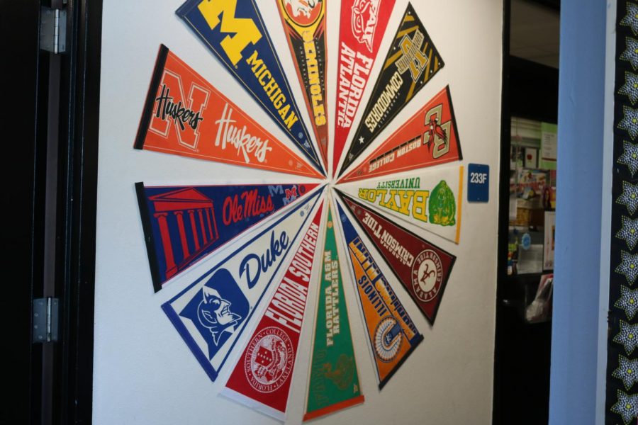 A wheel of college banners in Robinson’s guidance counselor office. 