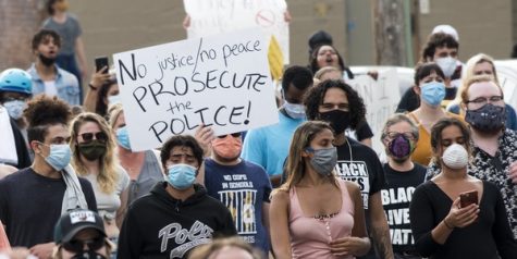 A sign reading No justice, no peace, prosecute the police, from a 2020 Black Lives Matter protest following Floyds murder (Protest against police violence - Justice for George Floyd by Fibonacci Blue is licensed under CC BY 2.0)