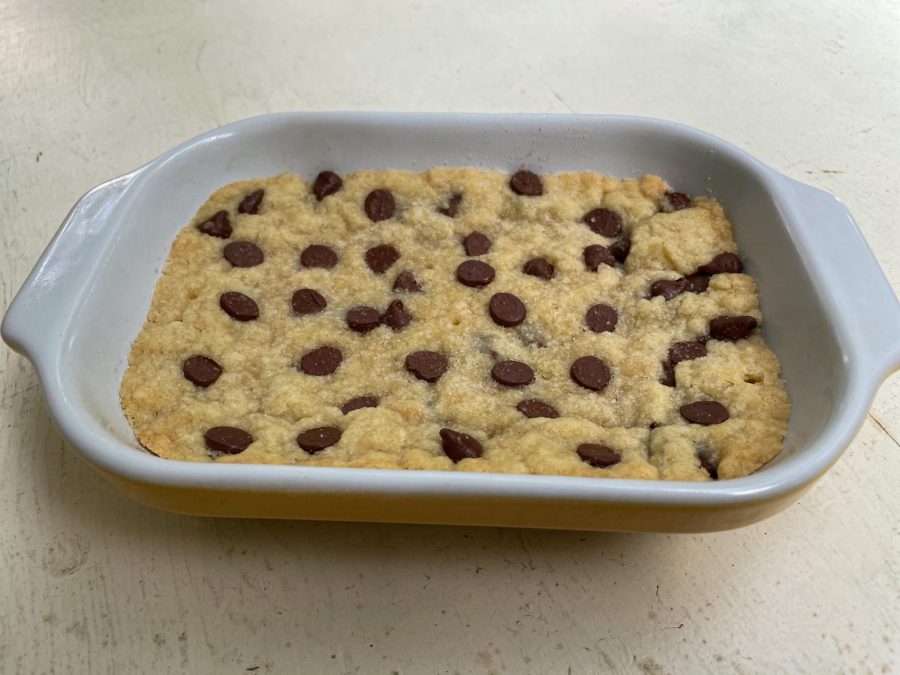 The completed bars fresh out of the oven, with chocolate chips slightly melted on top.