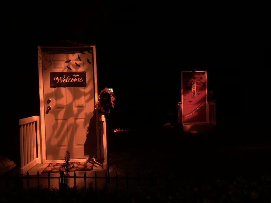 Two doors wait in the distance, welcoming and warning guests at Howl-O-Scream. They are only two of many doors that reside in the scare zone called Little Nightmares.