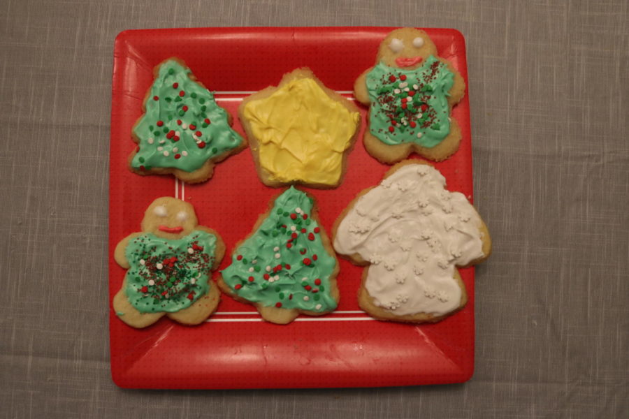 Sugar cookies topped with frosting and sprinkles. This is a fun activity to do during Christmas time.