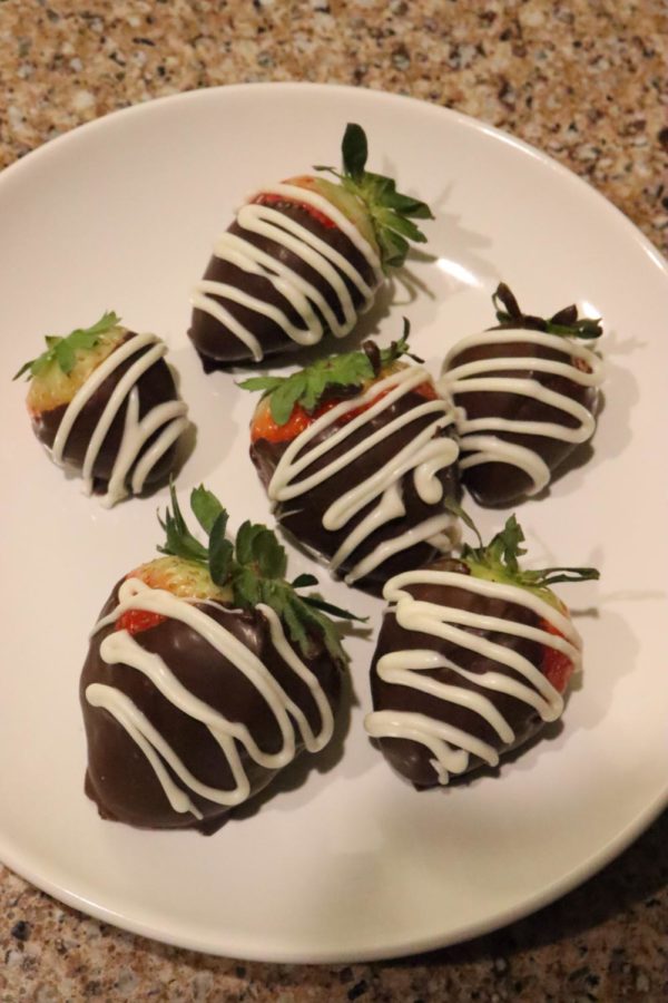 The finish product of some lovely chocolate covered strawberries.