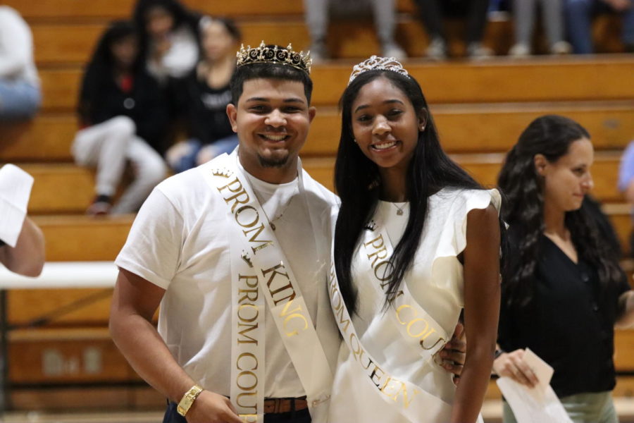 Malachi Hill (22) and Mattie Ward (22) pose for the camera at the pep rally as they were announced that they are this years prom king and queen. Being announced at the Pep Rally was hands down my favorite moment, Hill said. 