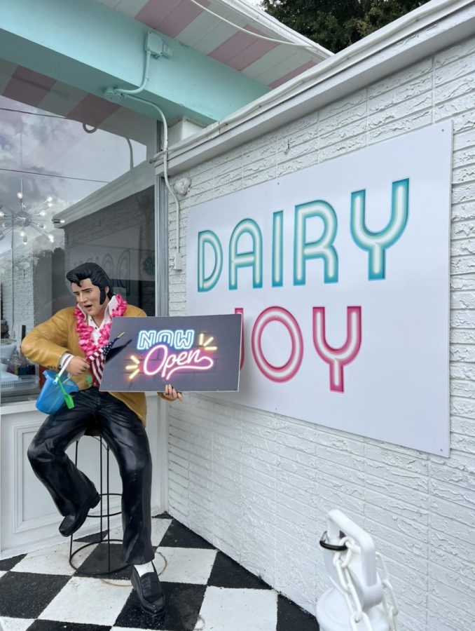 A statue of Elvis Presley and a sign with their logo welcomes you as you approach Dairy Joys new drive-thru. The drive-thru menu can be found behind this.