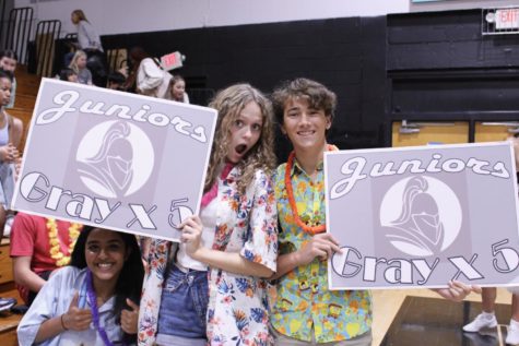 Maddy Berg (24) and Leyton Perkey (24) pose as they hold up the gray junior signs. Berg and Perkey are members of the Student Government Association (SGA), which planned the pep rally. My favorite part of the pep rally was seeing the juniors development. Last year, we were really quiet but I feel like weve definitely improved and Im so excited to see us become even more hype. Berg said. 