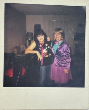 A younger Buffy Vassey poses next to eighth grade best friend in a polaroid taken in the late 80s.
