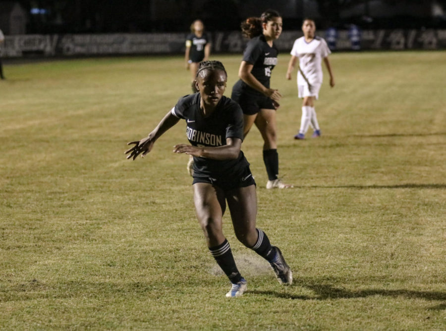 Adriana Williams (23) running after the ball.