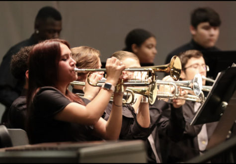 Kathrine Aguilair (‘25) plays her trumpet solo during the band’s winter concert.