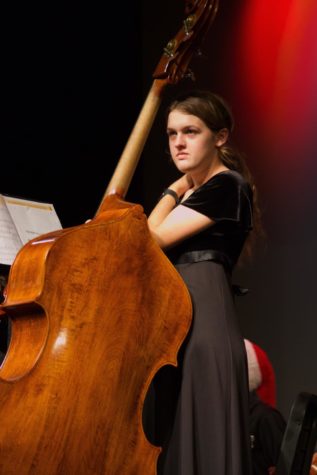 Vivian Gagnier (23)hold her bass before beginning her performance.
