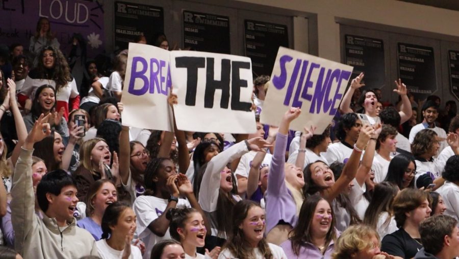 Thumbnail image of students celebrating the ninth point of the basketball game, breaking the silence. 