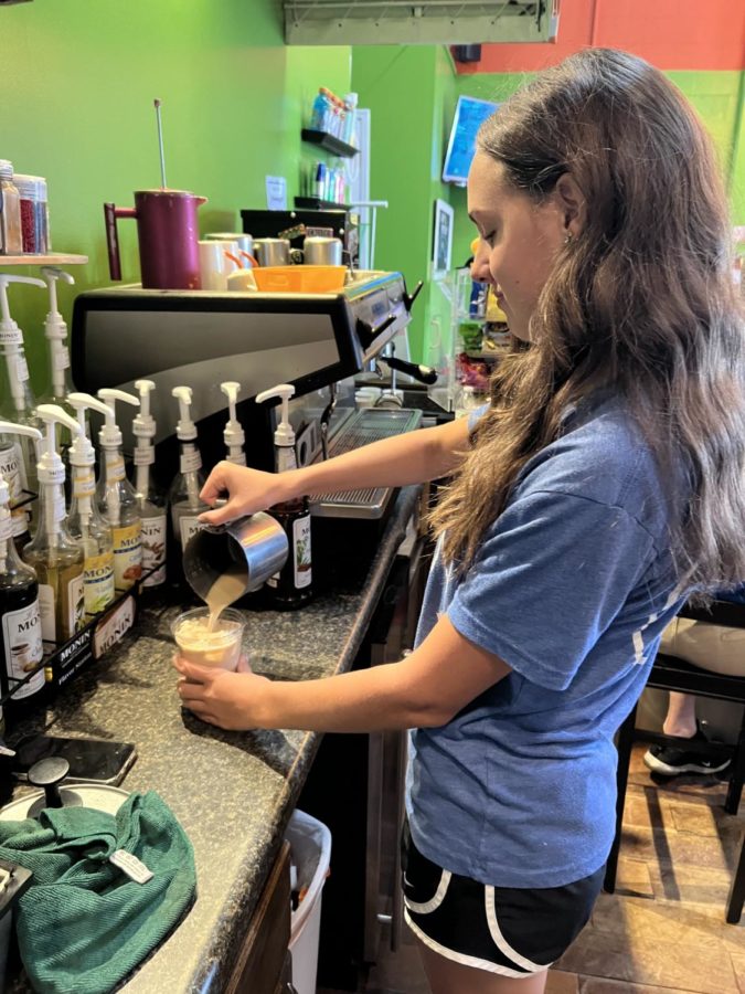 Amanda Whittlesey (23) making iced coffee at Playgrounds, where she works.