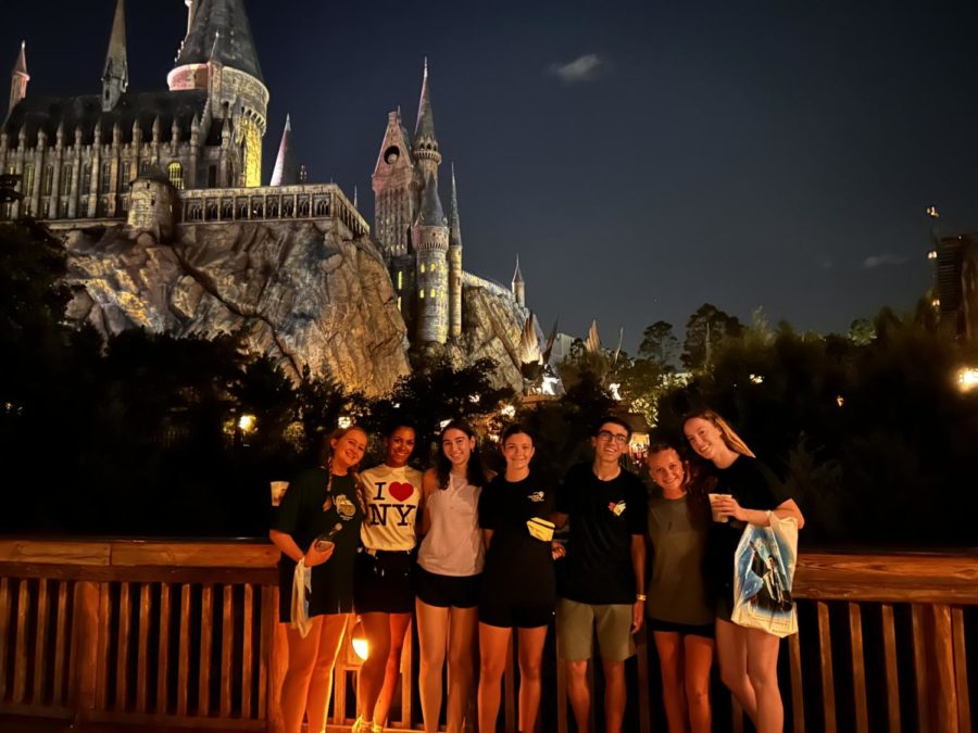 (From left to right) Seniors Maddy Ruyle, Shayla McIntyre, Grace Barrett, Bella Rodrigues, Austin White, Caroline Brindise and Kelsi White in front of the Hogwarts Castle at Universal Orlando. 