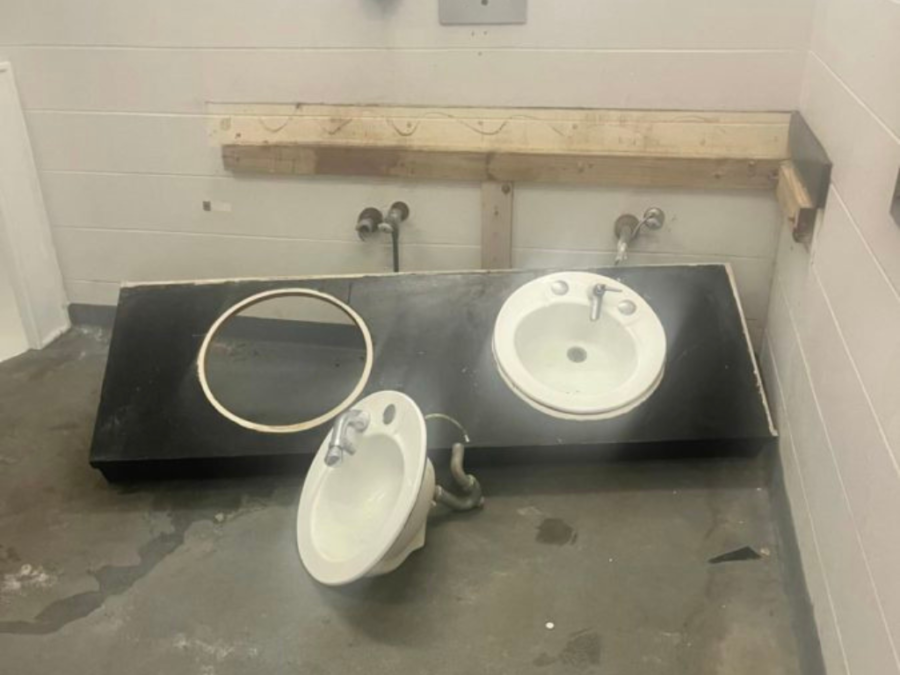 The sinks ripped from the wall in the mens stadium bathroom.