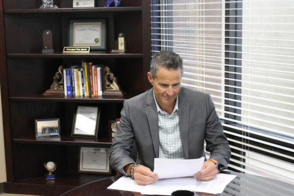 Interim Superintendent Van Ayres reviewing documents in his office. Ayres was appointed as Interim Superintendent after Addison Davis resignation.