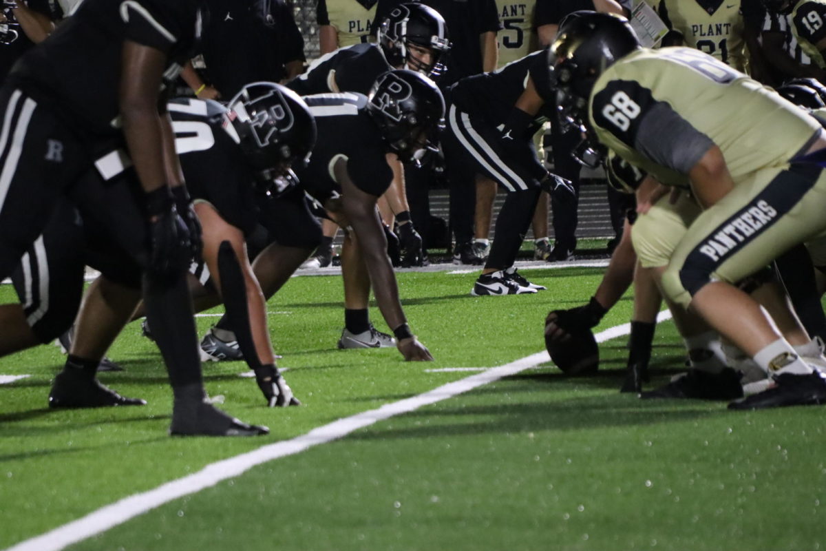 Robinson and Plant Panthers face head on at the line of scrimmage as they get ready for the next play. 