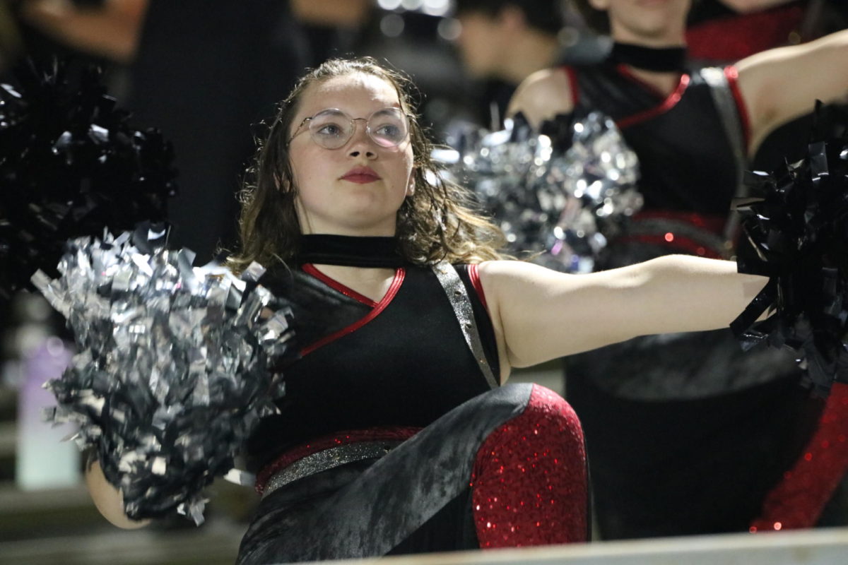 Gabby Toranzo (25) preforming with the Starlets during the Marching Knights halftime show.