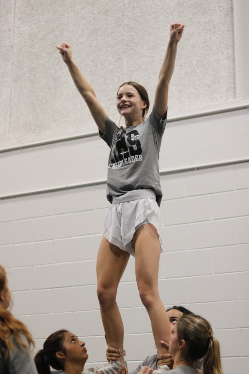 Katelyn Boyd (26) celebrates in the air after hitting a stunt.